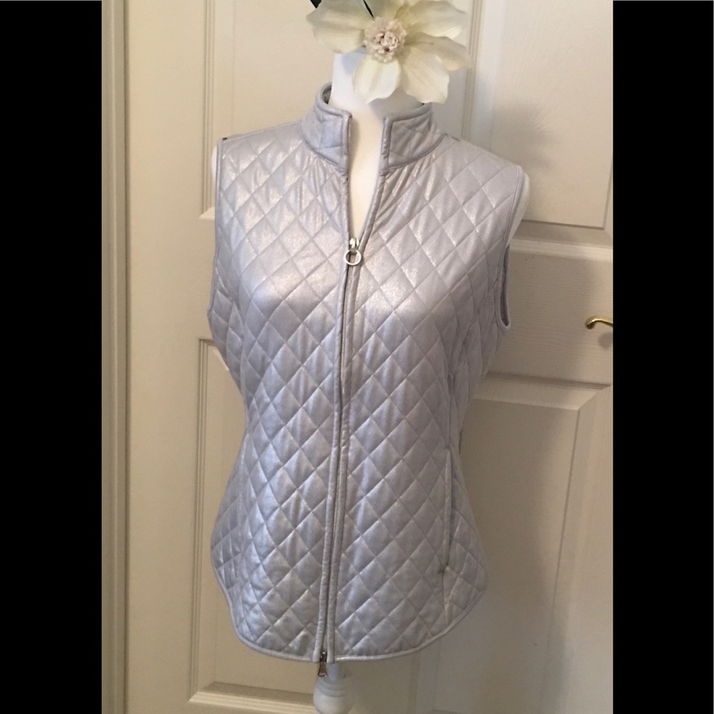 Silver Greg Norman Ladies golf vest.   So cute !